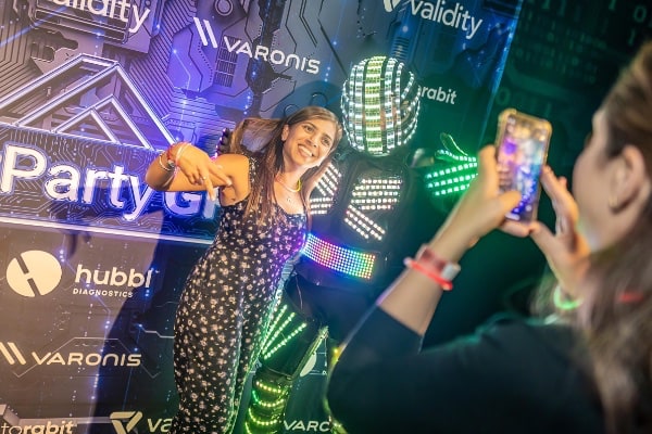 women having her photo taken with a phone