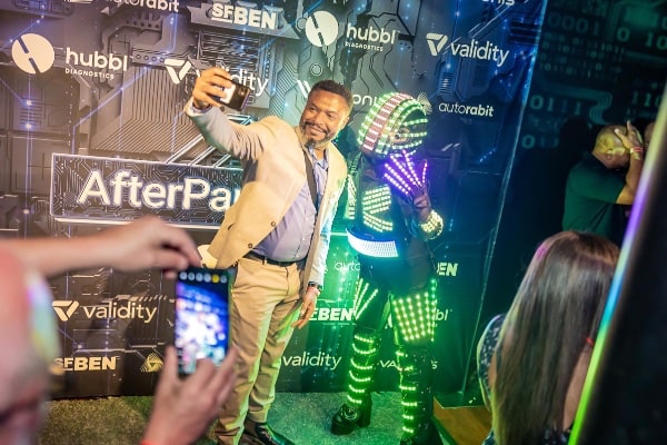 a person taking a selfie with a person wearing a garment