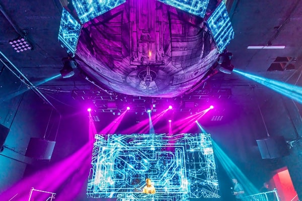 a person on a stage with lights